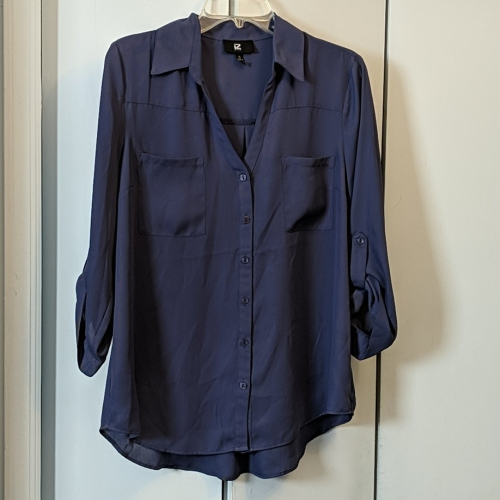 Dusty blue button down blouse.